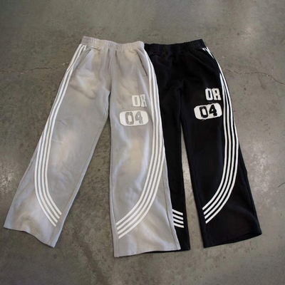 satın al Yan çizgileri ve özel logo tasarımı olan Erkekler için rüzgar kırıcı yüksek bel spor pantolonları online manufacture